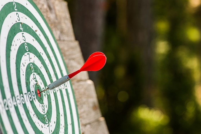 Dart hitting a dartboard