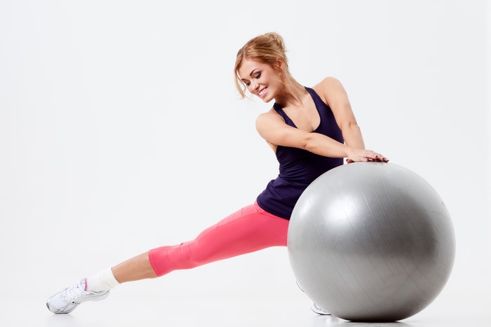 Woman exercising with a fitness ball