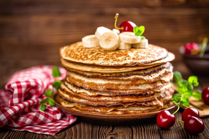 Stack of Pancakes with Bananas and Cherries