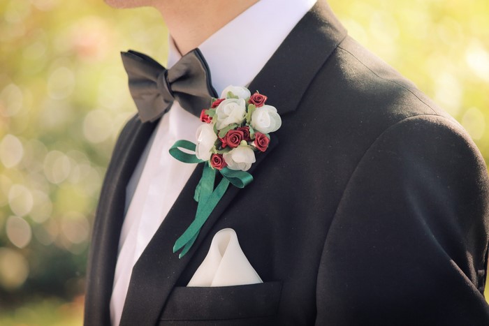 Man in Black Suit with Boutonniere and Bow Tie