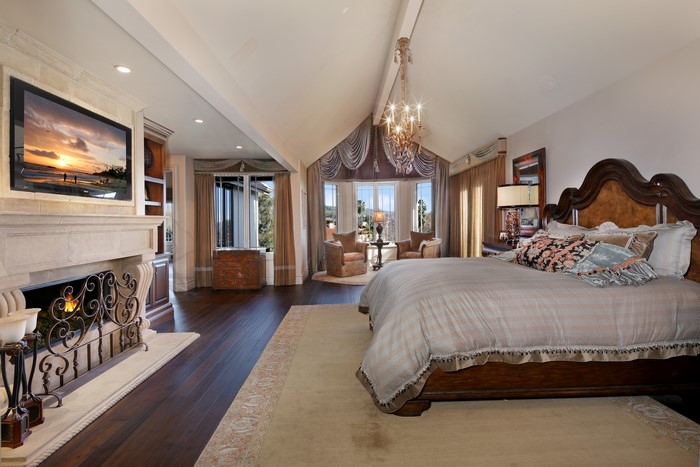 Luxury Bedroom with Fireplace and Chandelier