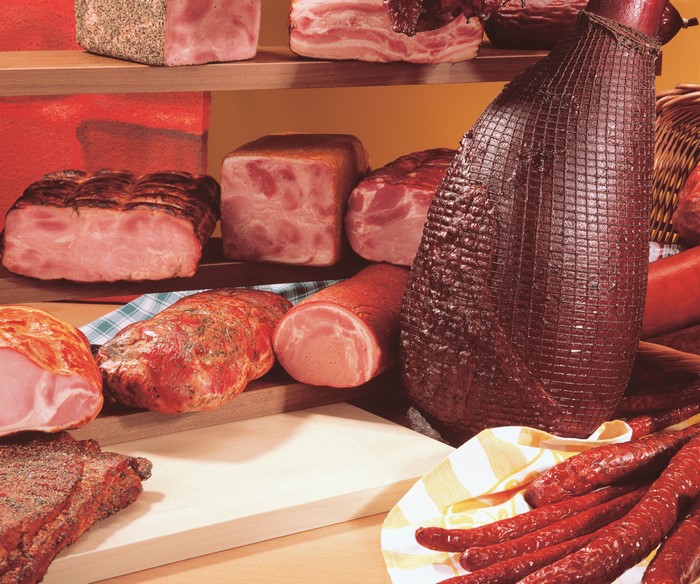Meat products, ham, and sausages on display