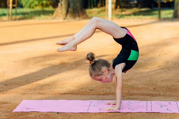 4K Young Girl Performing Gymnastics Handstand