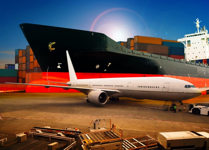 Cargo ship and airplane at a port