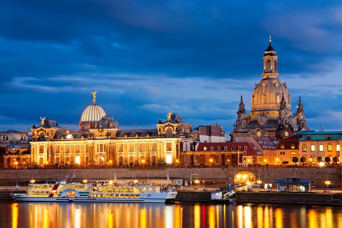 Dresden skyline with Frauenkirche and Elbe river at dusk