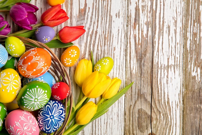Easter Eggs and Tulips on Wood Planks