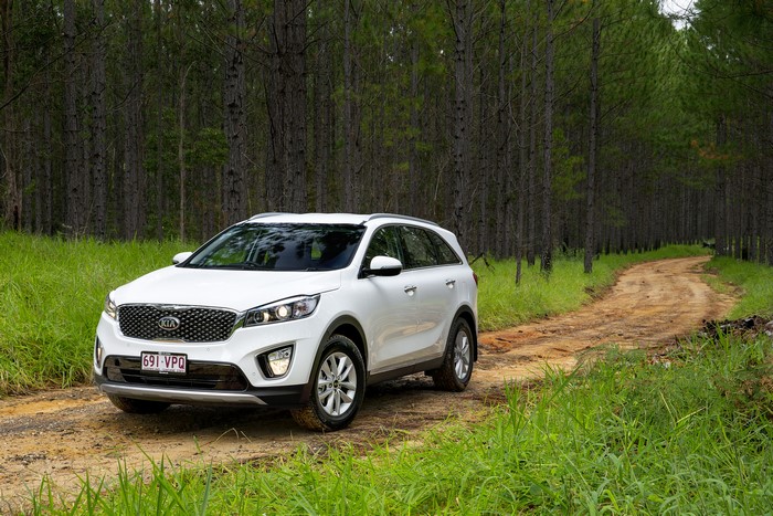 White Kia Sorento on a dirt road