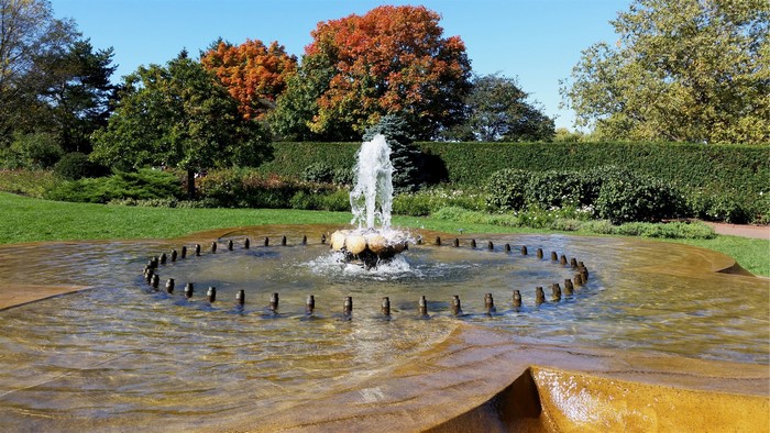 Fountain in a park with autumn trees