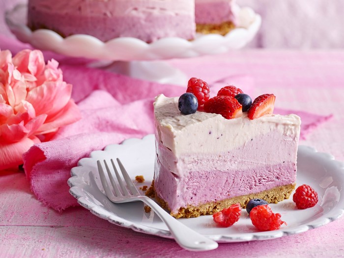 Berry layered cake slice with fork