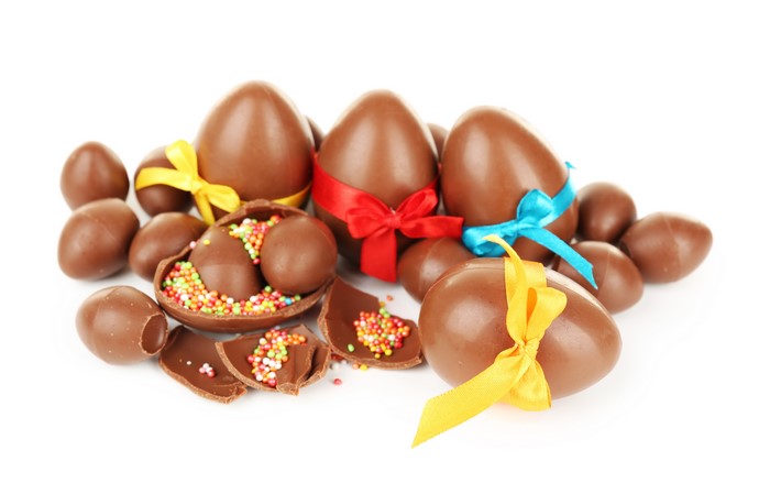 Easter Chocolate Eggs with Ribbons on White Background