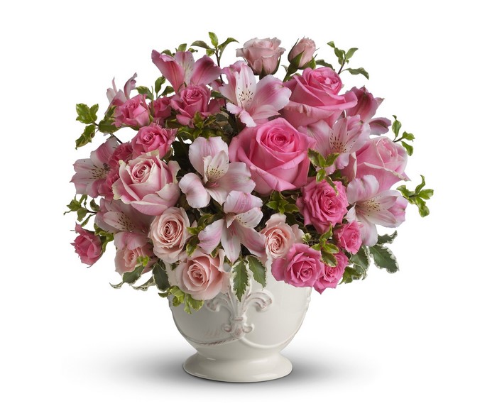 Pink roses and alstroemeria bouquet in a white vase