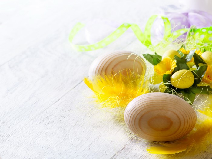 Easter Eggs with Yellow Feathers and Flowers