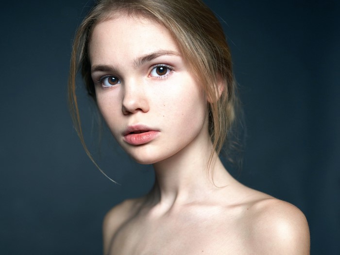 Portrait of a young woman with dark blonde hair