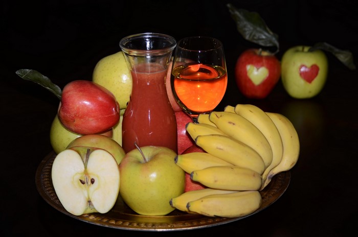4K Juice, Bananas, Apples, and Wine on Black Background
