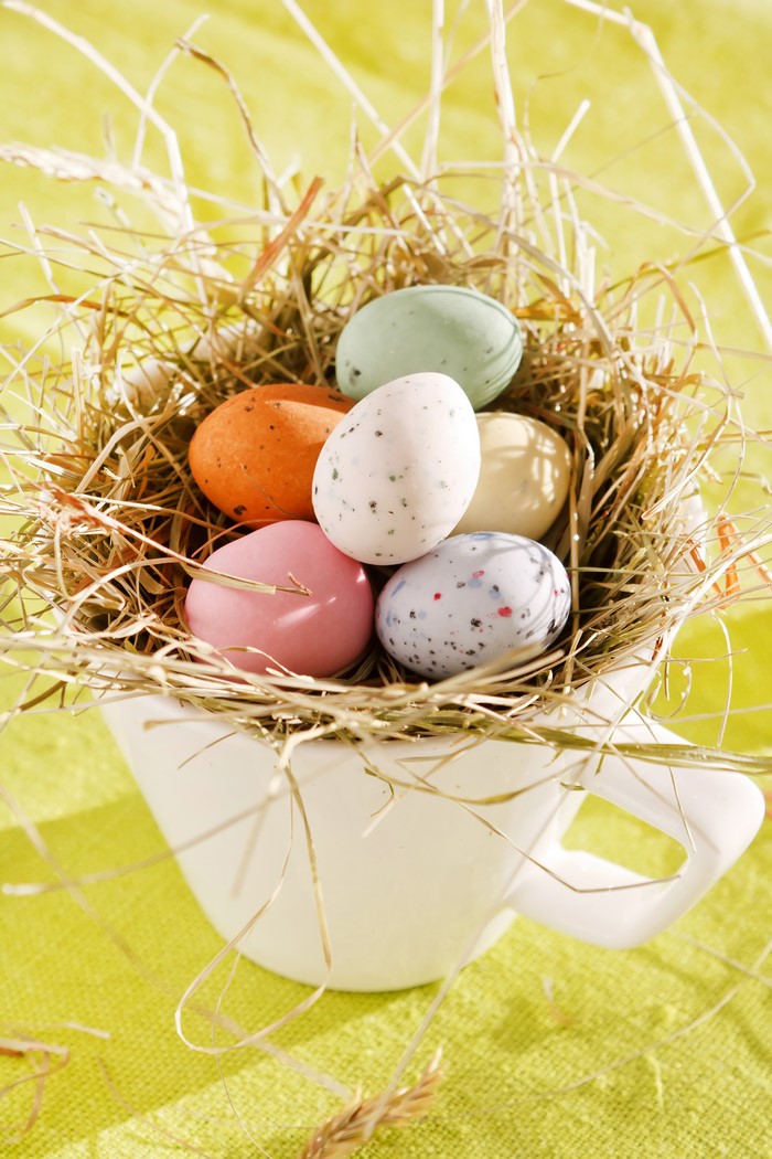 Easter eggs in a nest inside a cup