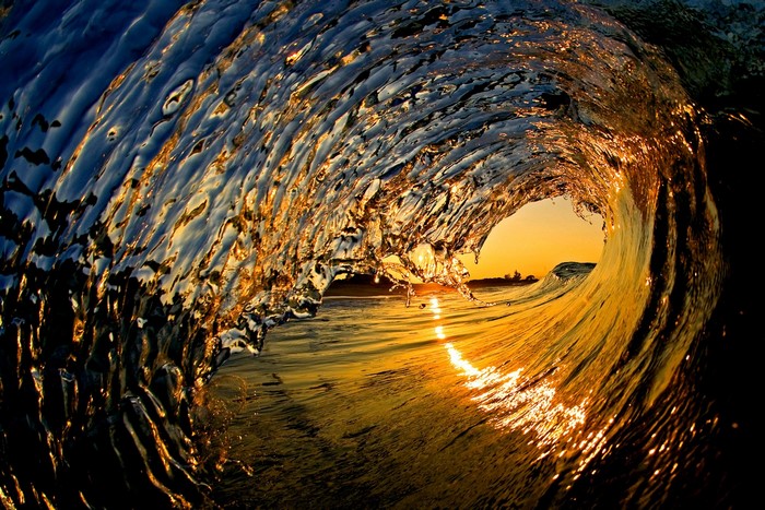 Inside a wave at sunset