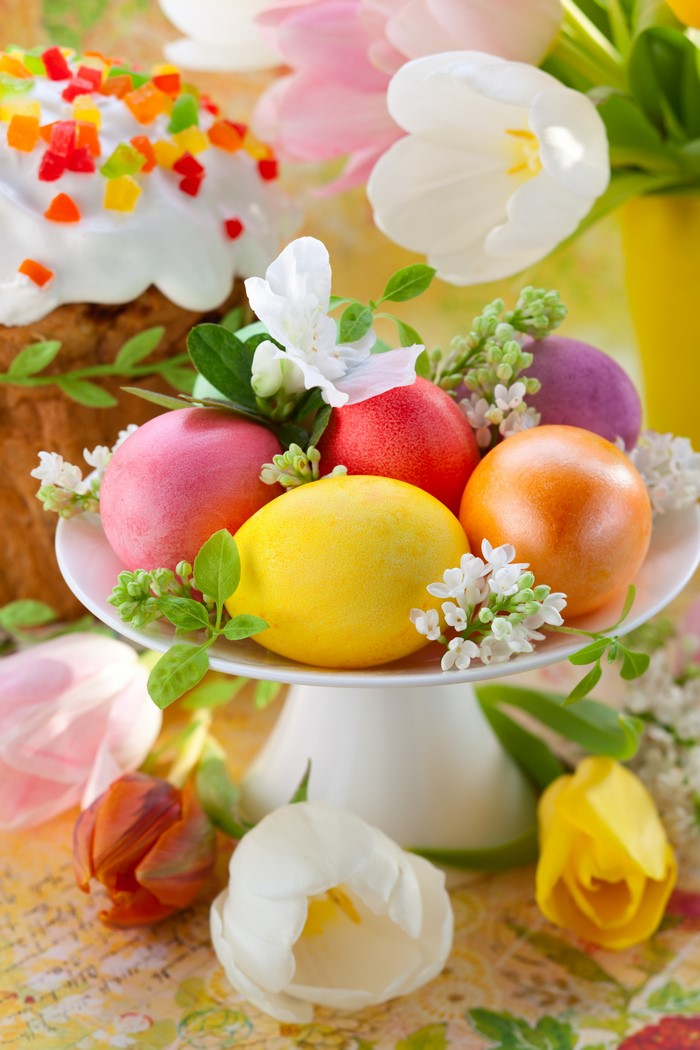 Easter cake and painted eggs with tulips