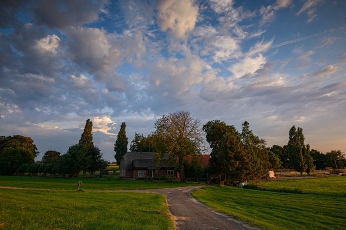 Farmhouse in the Netherlands with dramatic clouds