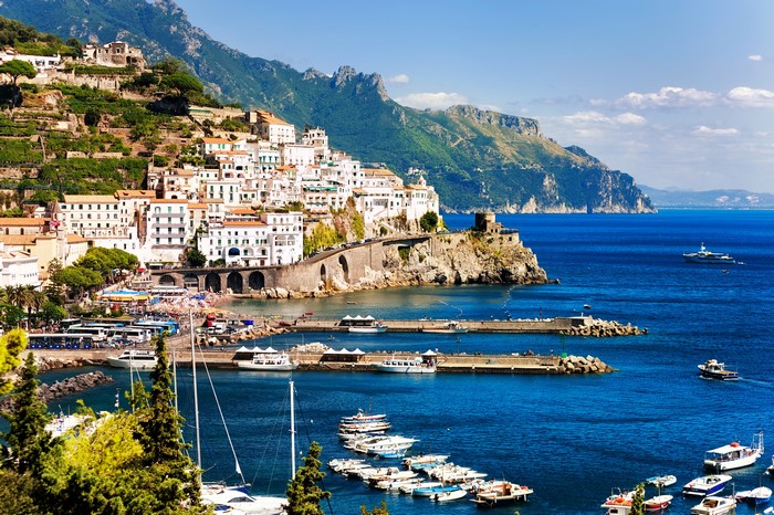 Amalfi Coast town with houses on a cliff overlooking the sea