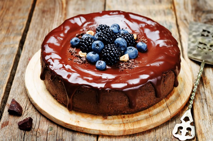 Chocolate cake with berries and nuts