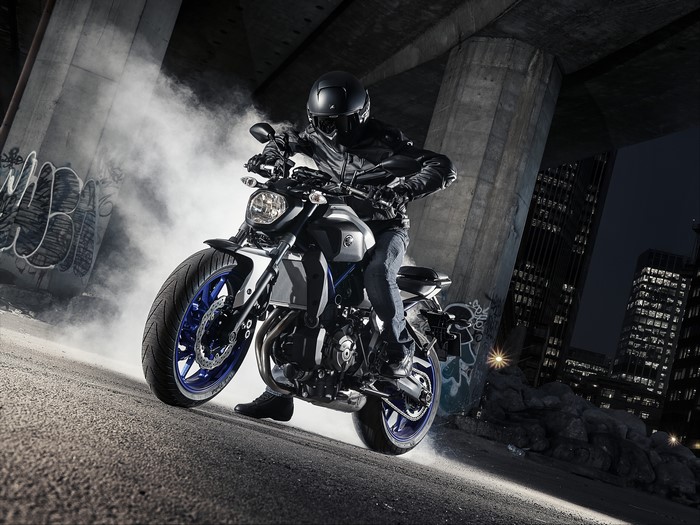 Motorcyclist on Yamaha MT-07 under bridge at night