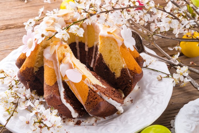 Easter Kulich cake with almond slices and flowers