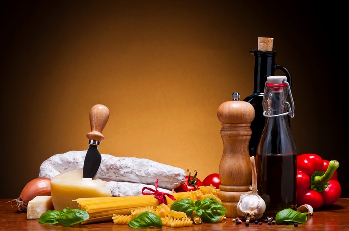 Still-life of Italian ingredients with cheese and sausage