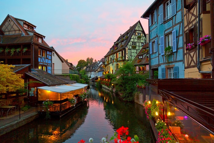 Colmar, France canal at dusk with colorful buildings