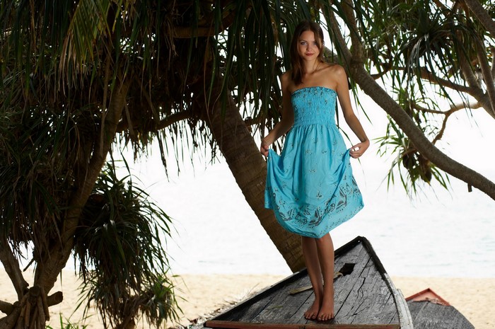 Woman in blue dress on a boat