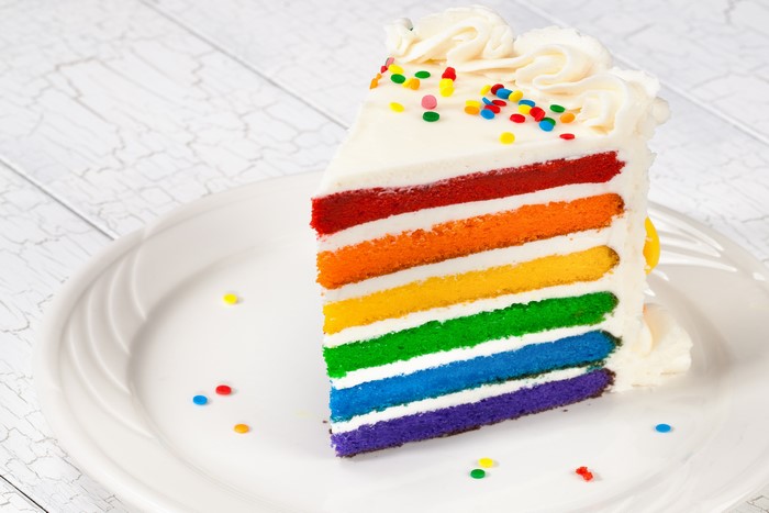 Slice of Rainbow Layer Cake with Sprinkles