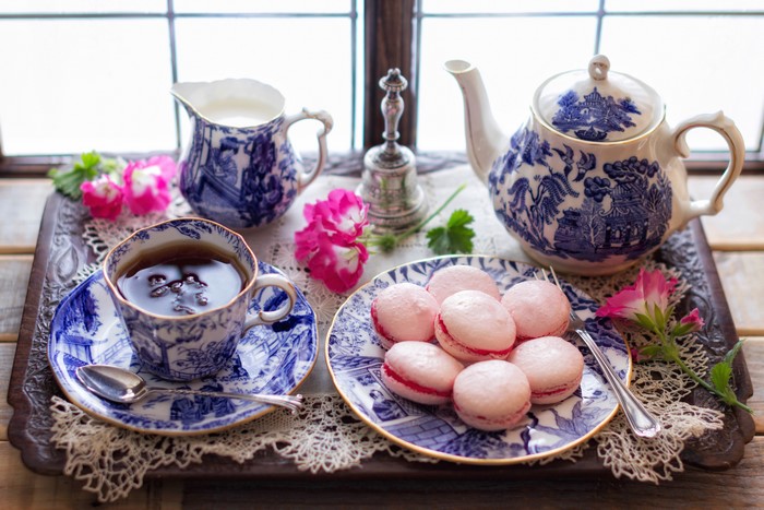 Tea set with macarons and flowers