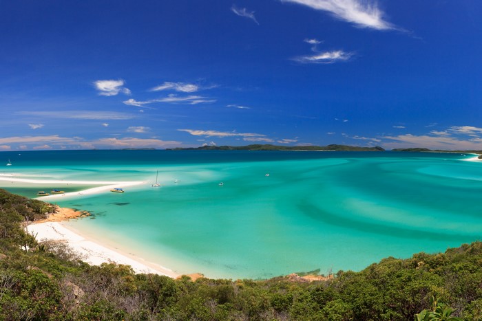 Whitehaven Beach, Australia, with turquoise water and sailboats