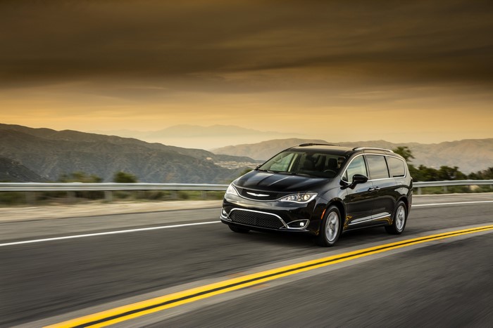 Black 2017 Chrysler Pacifica Touring-L Plus driving on a road