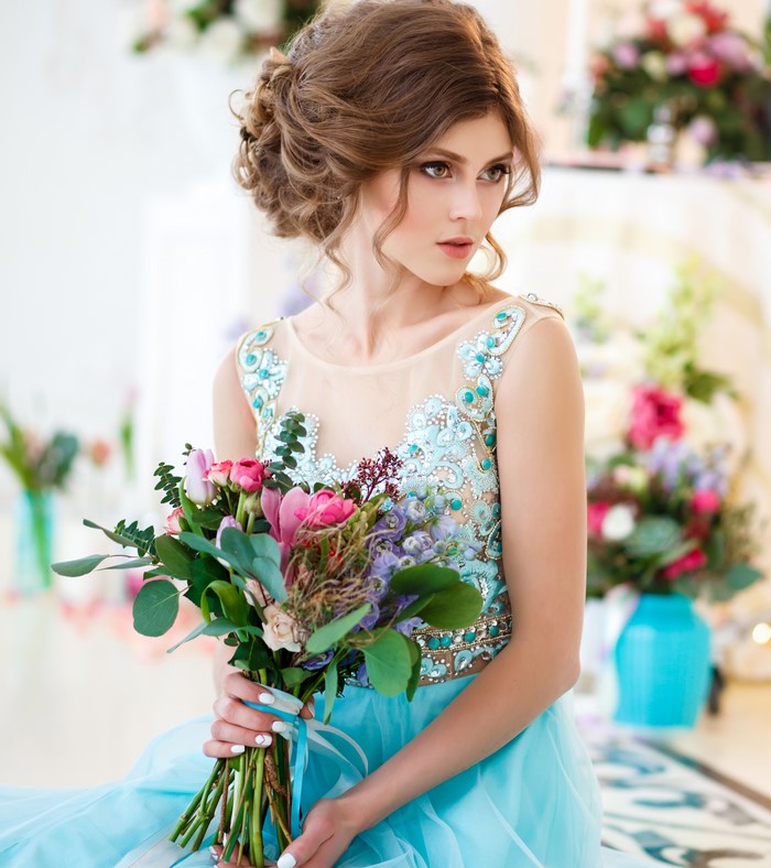Woman with Brown Hair Holding Bouquets