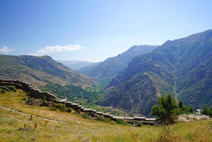 Stone wall ruins overlooking a valley in Armenia