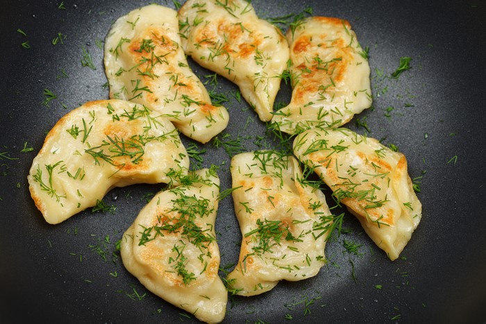 Pierogi varenyky with dill in a pan