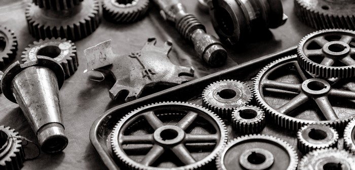 Close-up of various metal gears and mechanical parts