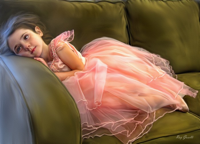 Girl in pink dress lying on a sofa