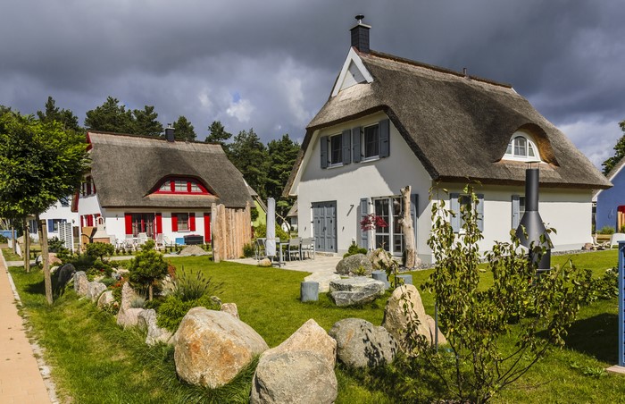 Thatched roof houses with stones and grass in Germany