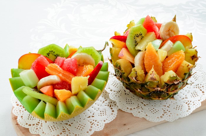 Fruit salad in melon and pineapple bowls