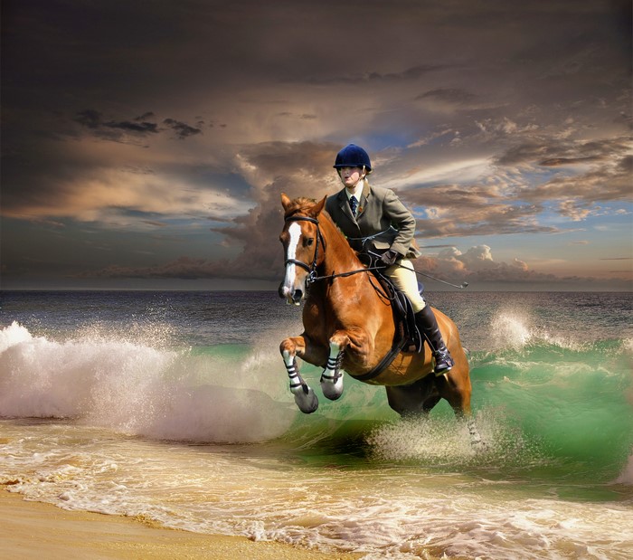 Horse and Rider Jumping Waves on Coast