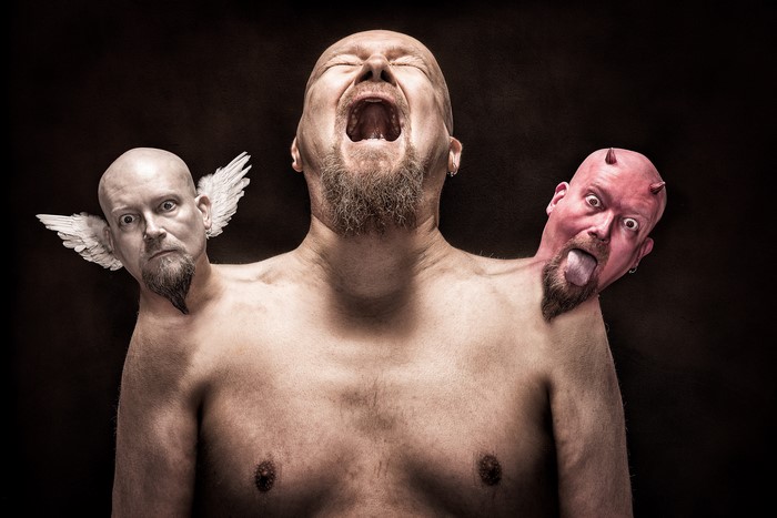 Man with angel and demon heads screaming