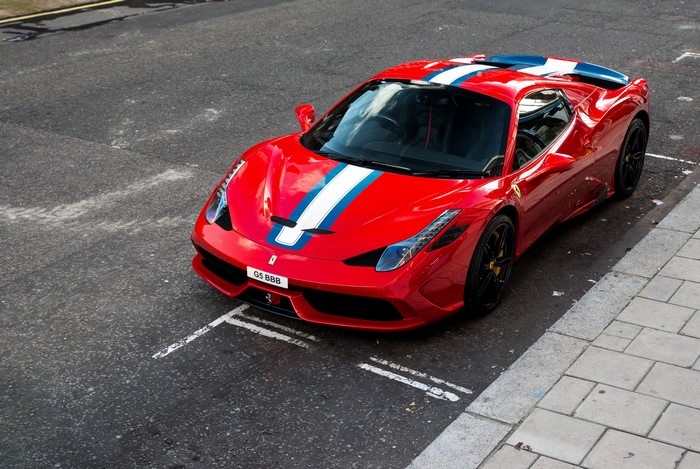 Red Ferrari 458 Speciale A with racing stripes