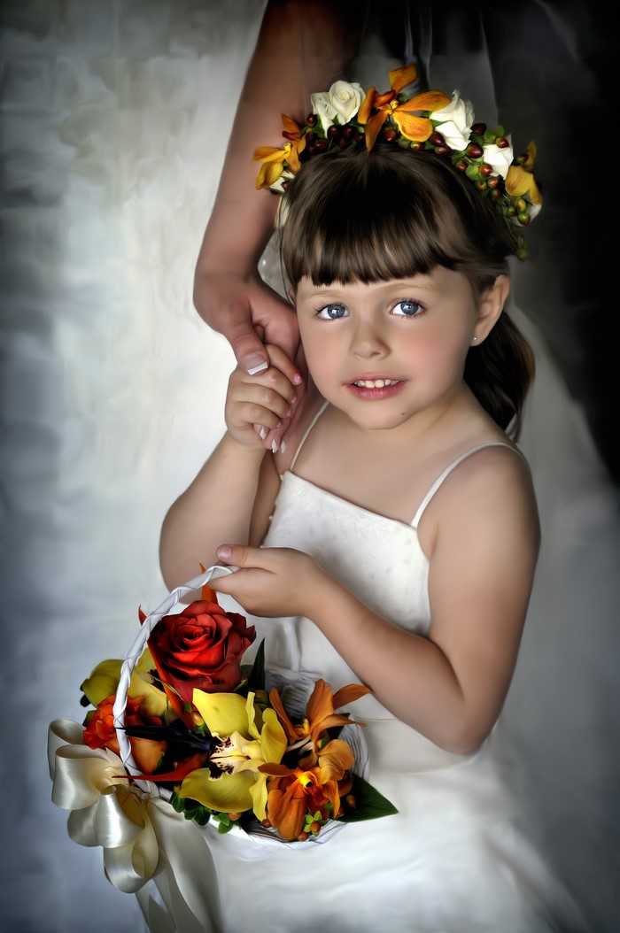 Flower girl holding a basket of flowers