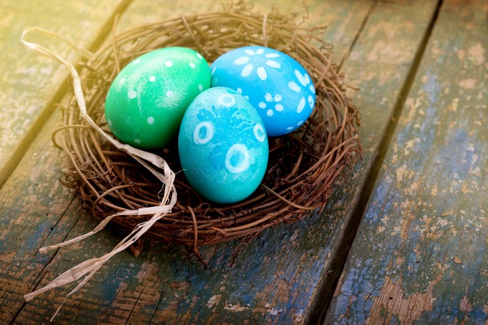 Easter Eggs in a Nest on Wood Planks