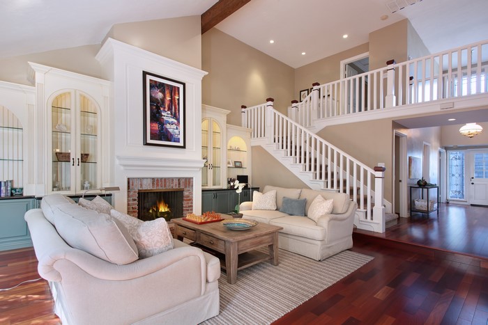 Living room with fireplace and stairs