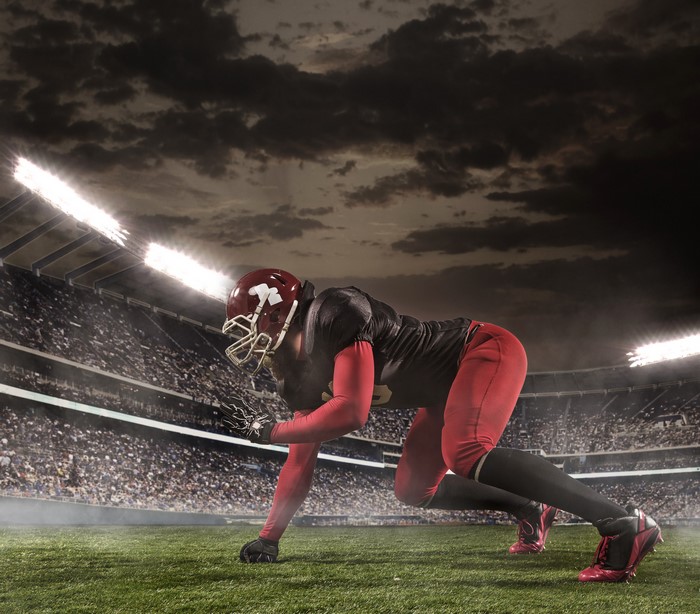 American football player in uniform at stadium
