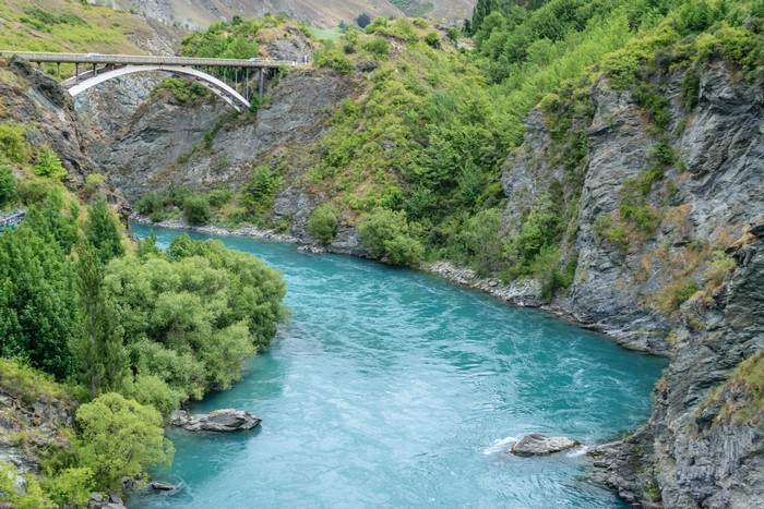 Kawarau Gorge Bridge over turquoise river in New Zealand