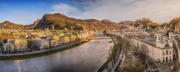 Salzburg cityscape with river and mountains