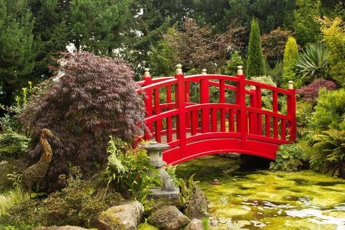 Red bridge over a pond in Mount Pleasant Gardens, United Kingdom